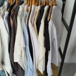 Short-sleeve shirts in many fabrics and colours on a rack