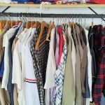 T-shirts, polos and tops on a garment rack at the Lingyu sample room