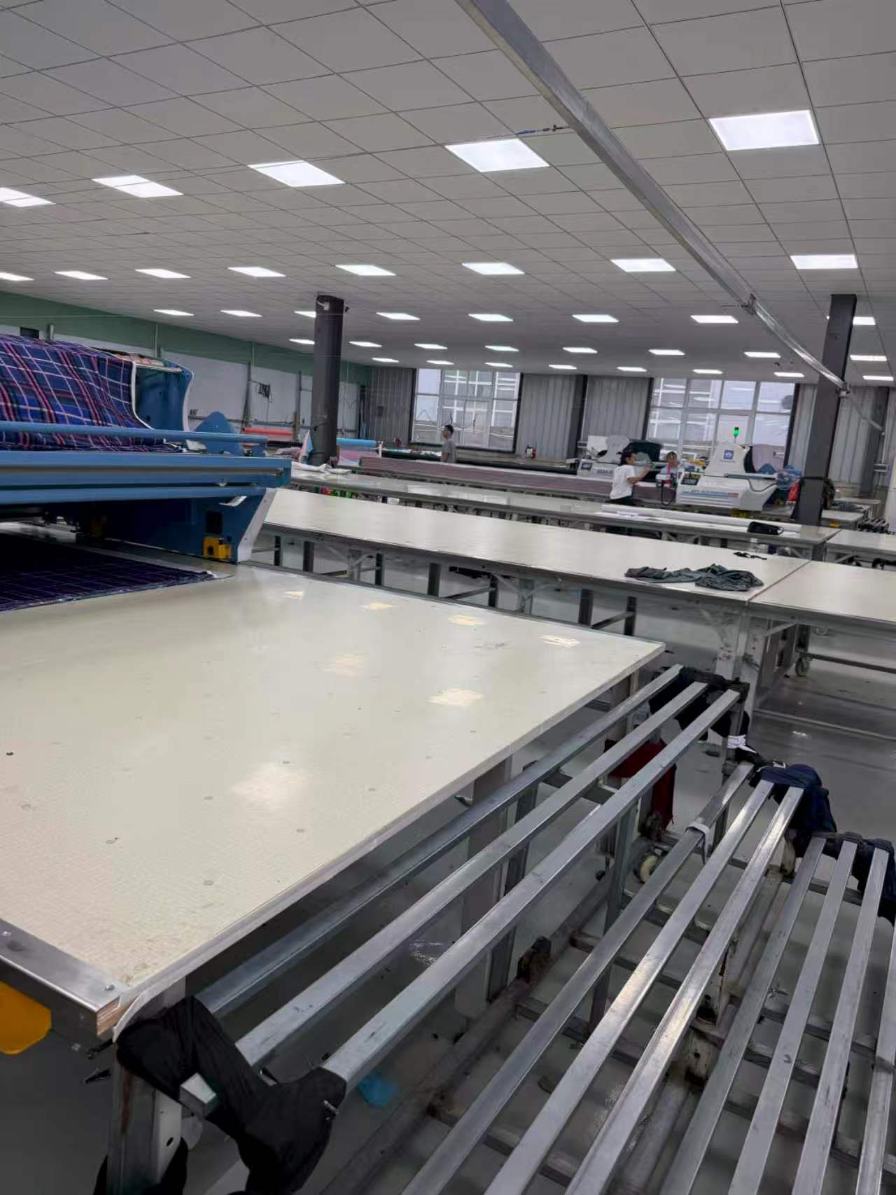 Sewing lines with workers at the Lingyu garment factory